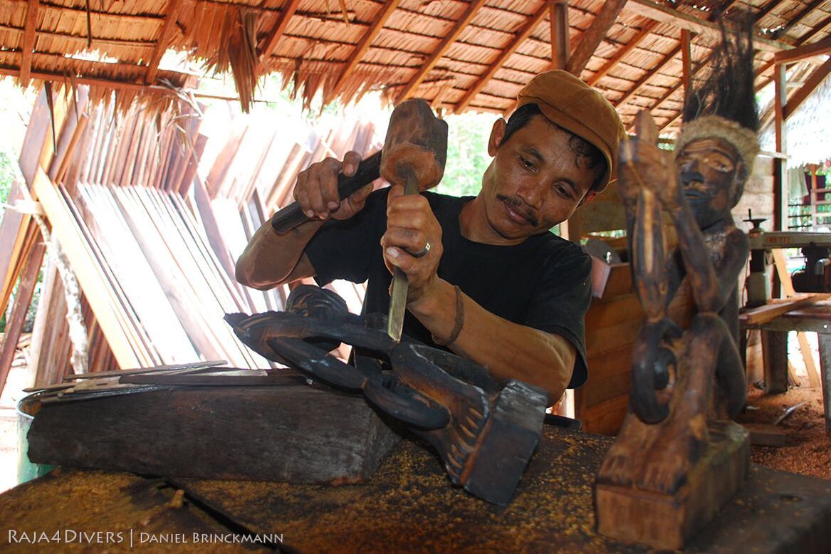 Man carving sculpture